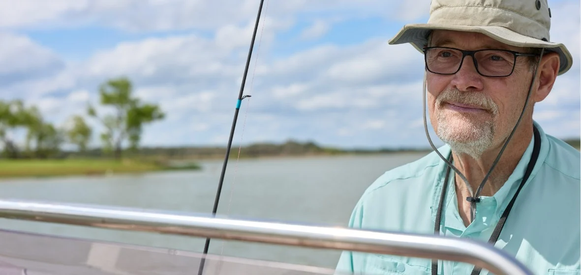Bill, living with GIST, fishing on a lake